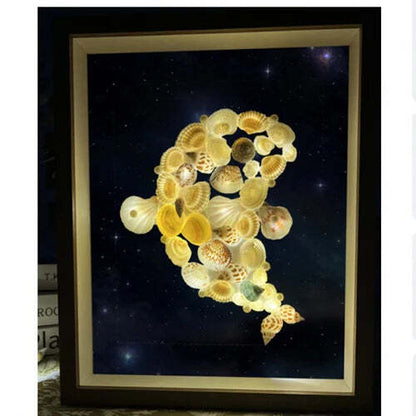Lámpara de cielo estrellado hecha con conchas de mar
