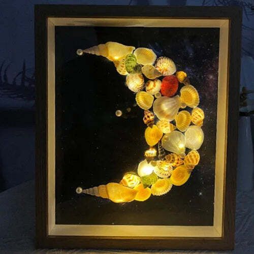 Lámpara de cielo estrellado hecha con conchas de mar