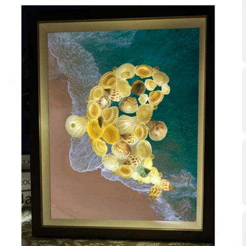 Lámpara de cielo estrellado hecha con conchas de mar