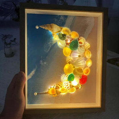 Lámpara de cielo estrellado hecha con conchas de mar